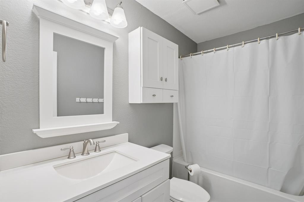 7006 Burning Bush Sachse, TX 75048 - Photo 25 of 39 a bathroom with a sink toilet and shower