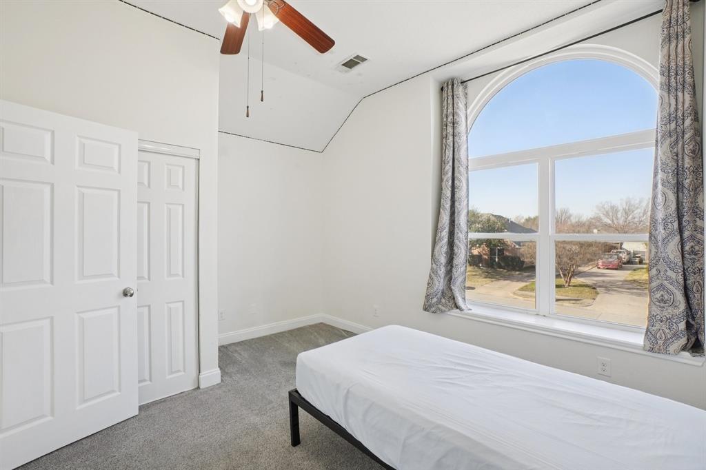 7006 Burning Bush Sachse, TX 75048 - Photo 26 of 39 a bedroom with a bed and a window