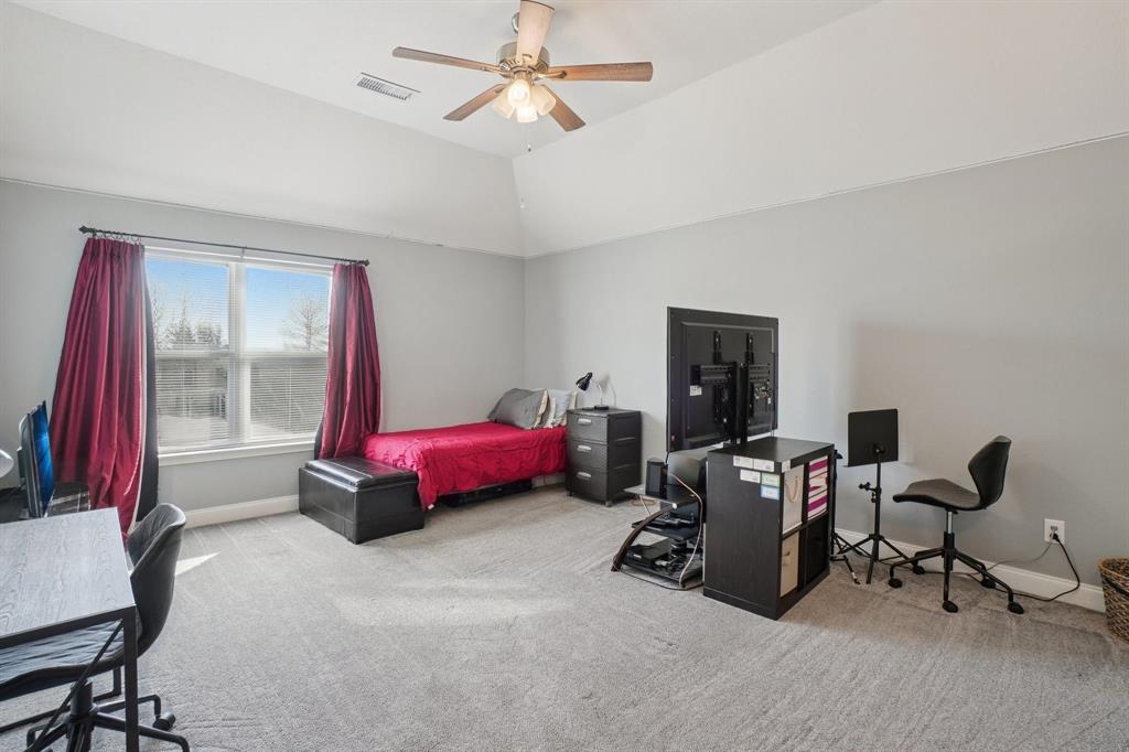 7006 Burning Bush Sachse, TX 75048 - Photo 29 of 39 a bedroom with furniture and a window