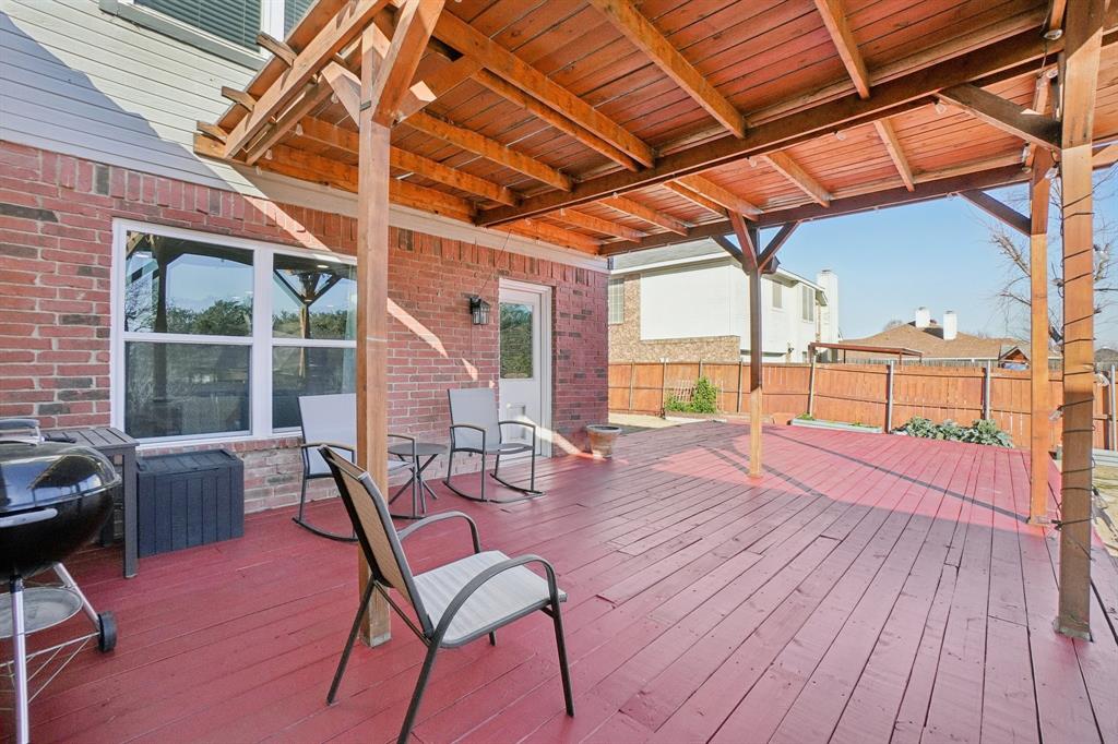 7006 Burning Bush Sachse, TX 75048 - Photo 33 of 39 a patio with table and chairs