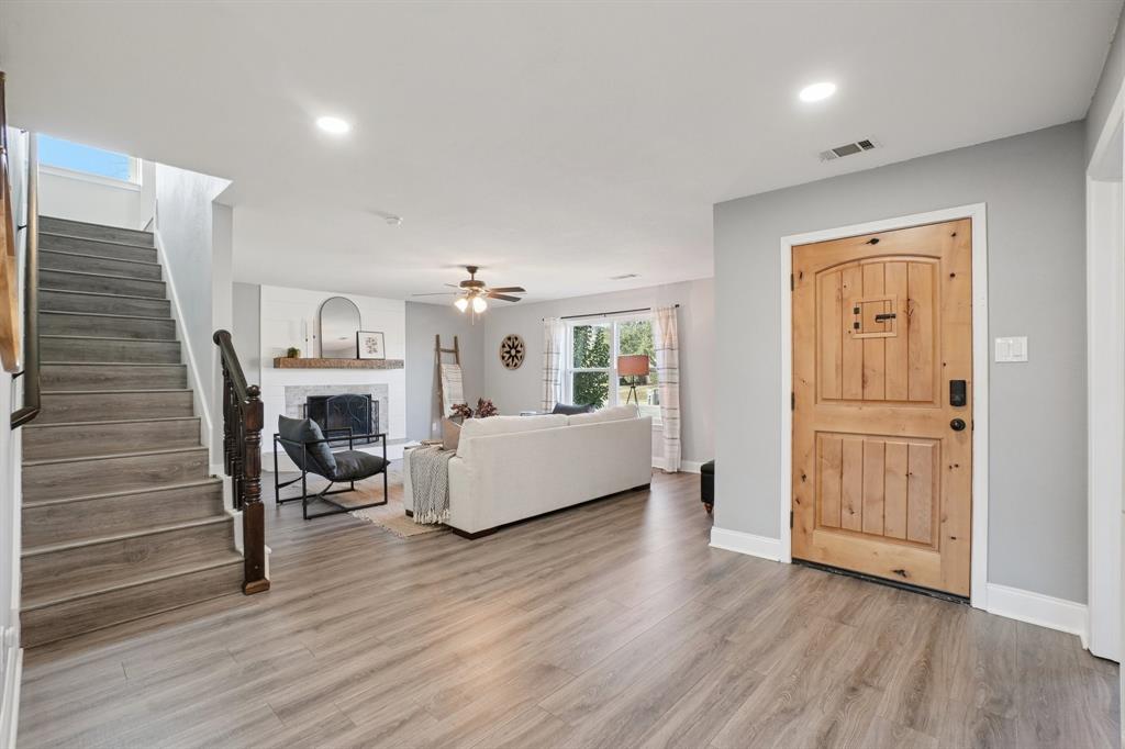 7006 Burning Bush Sachse, TX 75048 - Photo 4 of 39 a living room with furniture and a fireplace