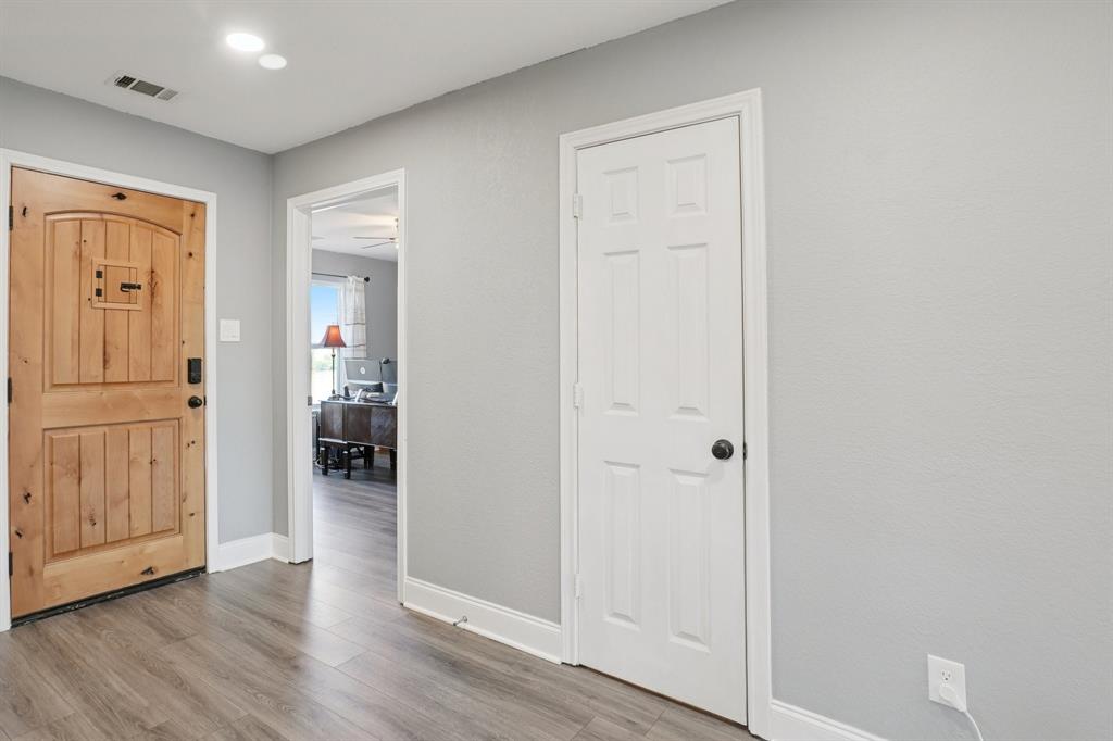 7006 Burning Bush Sachse, TX 75048 - Photo 5 of 39 a view of a hallway with wooden floor
