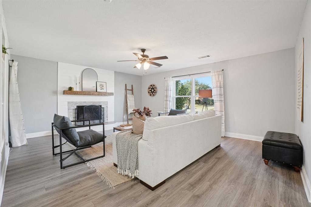 7006 Burning Bush Sachse, TX 75048 - Photo 7 of 39 a living room with furniture and a fireplace
