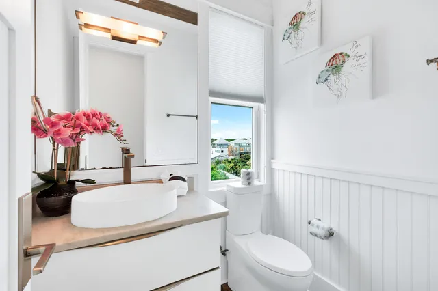 a living room with furniture and floor to ceiling windows