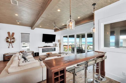 a kitchen with kitchen island a sink and a stove