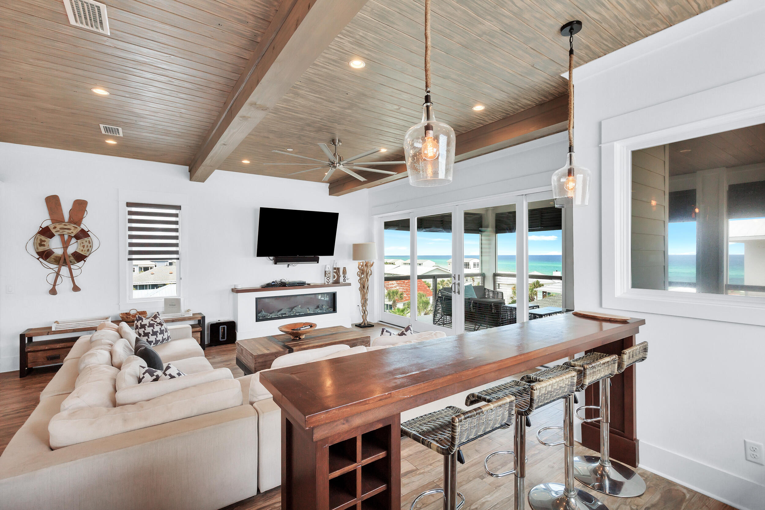 64 Emerald Cove Lane South Inlet Beach, FL 32461 - Photo 26 of 44 a kitchen with stainless steel appliances kitchen island granite countertop a stove a oven a dining table and chairs with the kitchen view