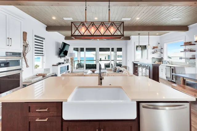 a large kitchen with a table and chairs