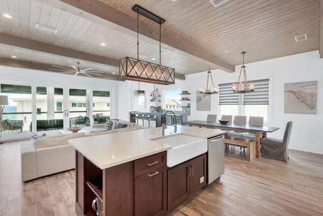 a kitchen with stainless steel appliances granite countertop a stove and a sink