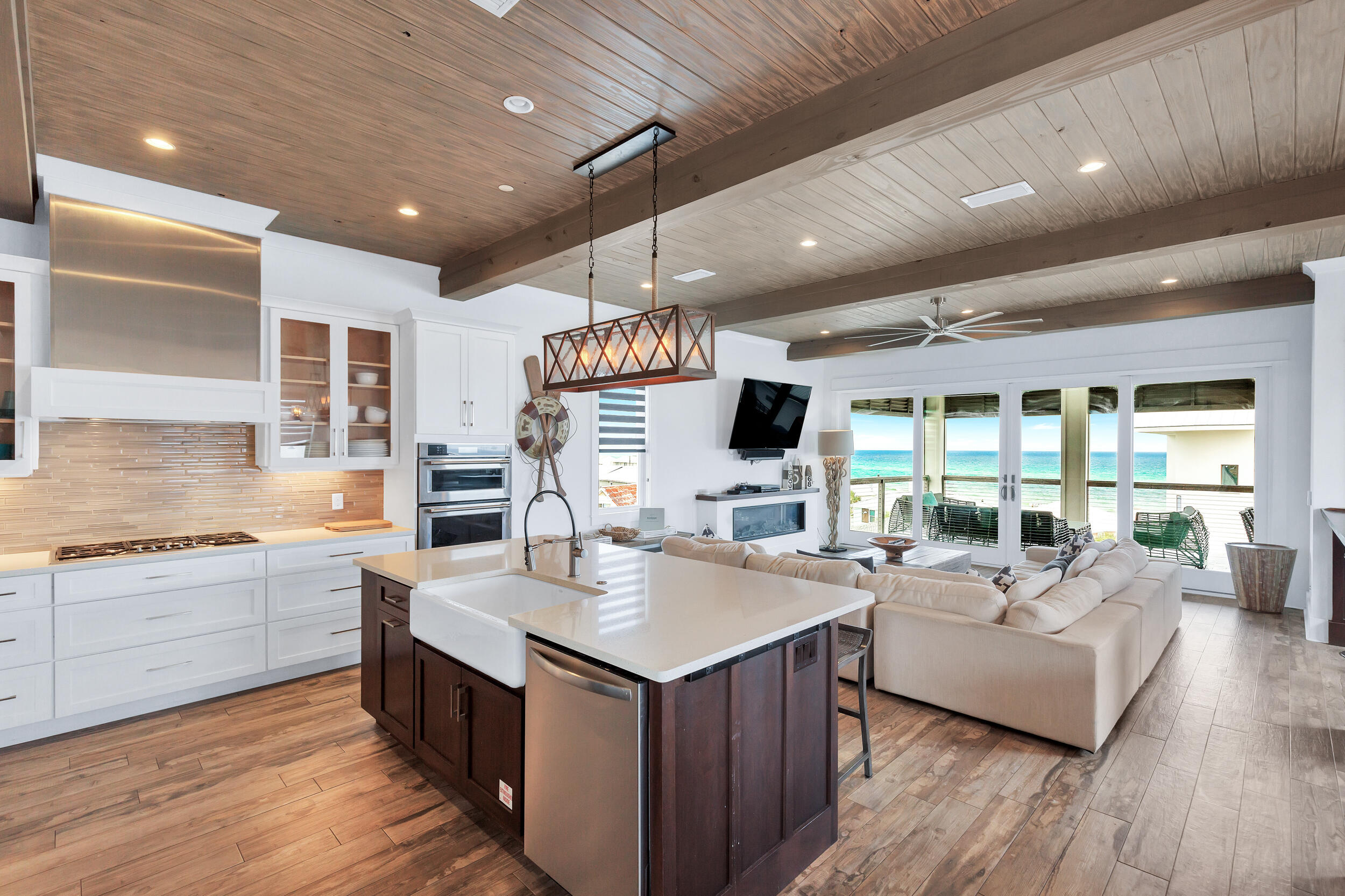 64 Emerald Cove Lane South Inlet Beach, FL 32461 - Photo 34 of 44 a living room with stainless steel appliances kitchen island granite countertop a sink and a large window