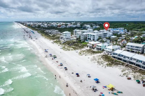 a front view of a residential apartment building with a yard