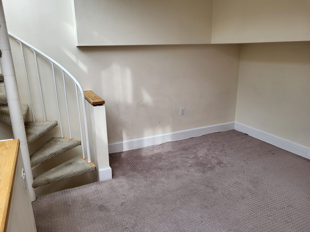 35 Walden Street, Unit 3B Cambridge, MA 02140 - Photo 24 of 39 wooden floor in an empty room