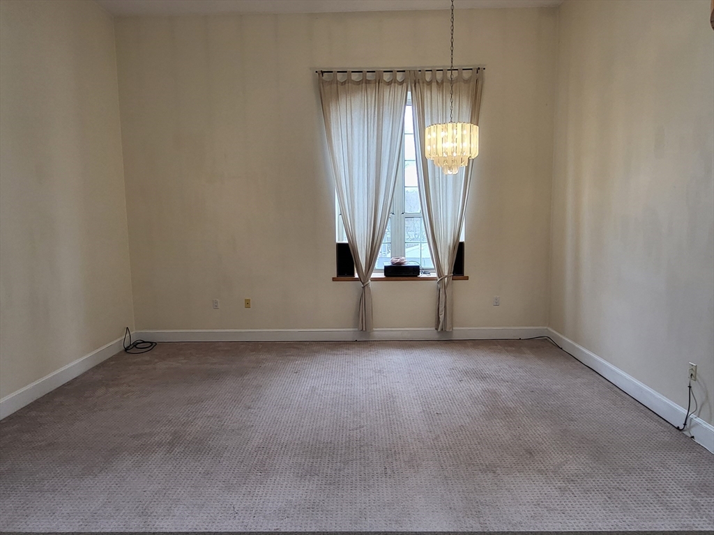 35 Walden Street, Unit 3B Cambridge, MA 02140 - Photo 3 of 39 an empty room with windows