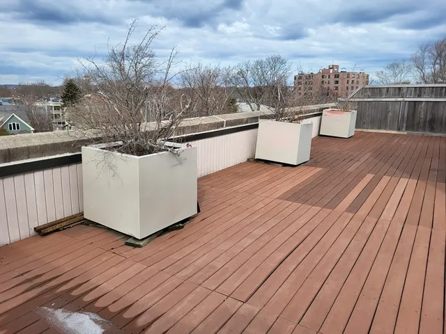 a view of balcony and wooden floor