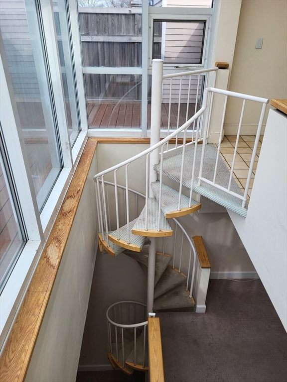 35 Walden Street, Unit 3B Cambridge, MA 02140 - Photo 33 of 39 a view of balcony and wooden floor