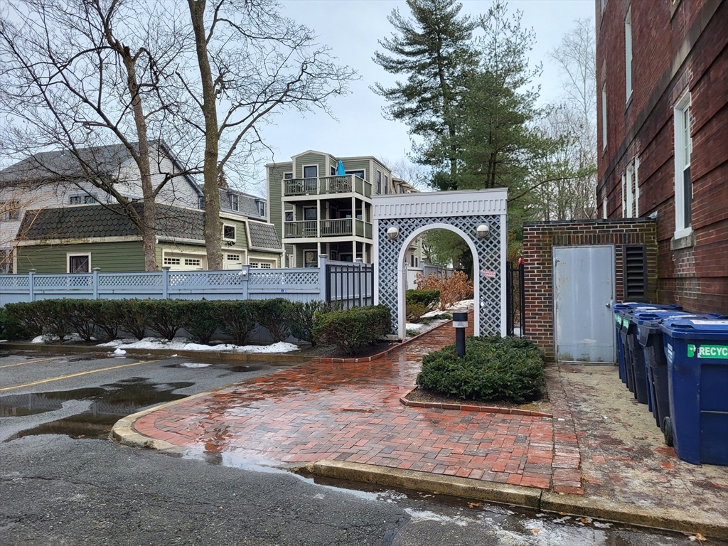 35 Walden Street, Unit 3B Cambridge, MA 02140 - Photo 37 of 39 a front view of a house with garden