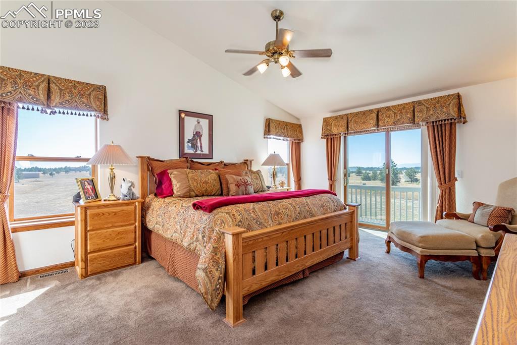 18165 Pinon Park Road Peyton, CO 80831 - Photo 16 of 44 a bedroom with a bed and a couch