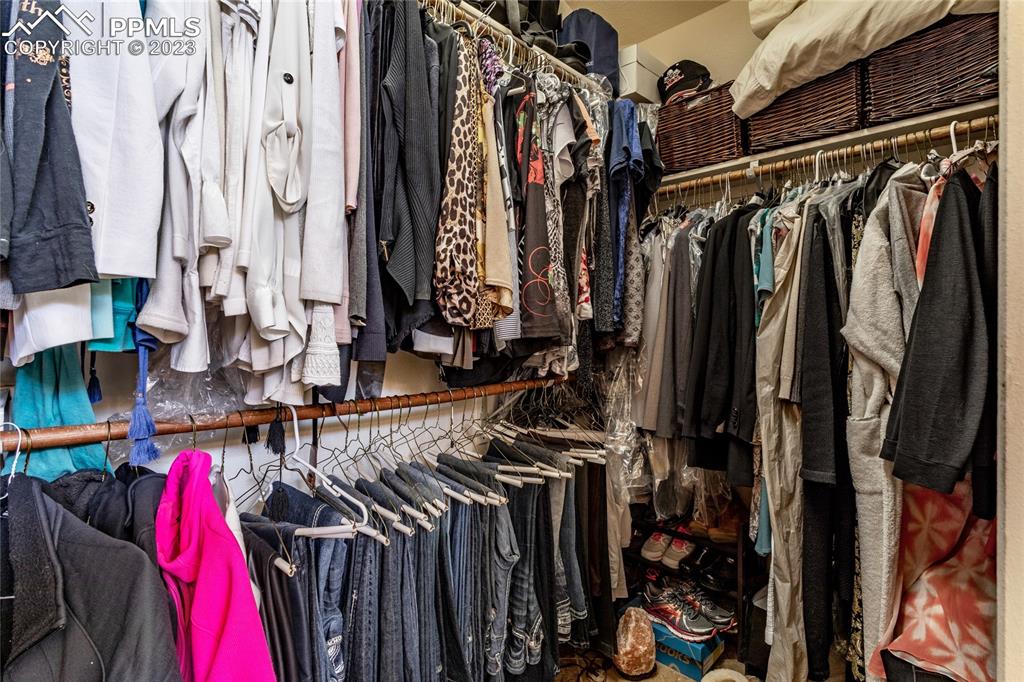 18165 Pinon Park Road Peyton, CO 80831 - Photo 21 of 44 a view of walk in closet with clothes