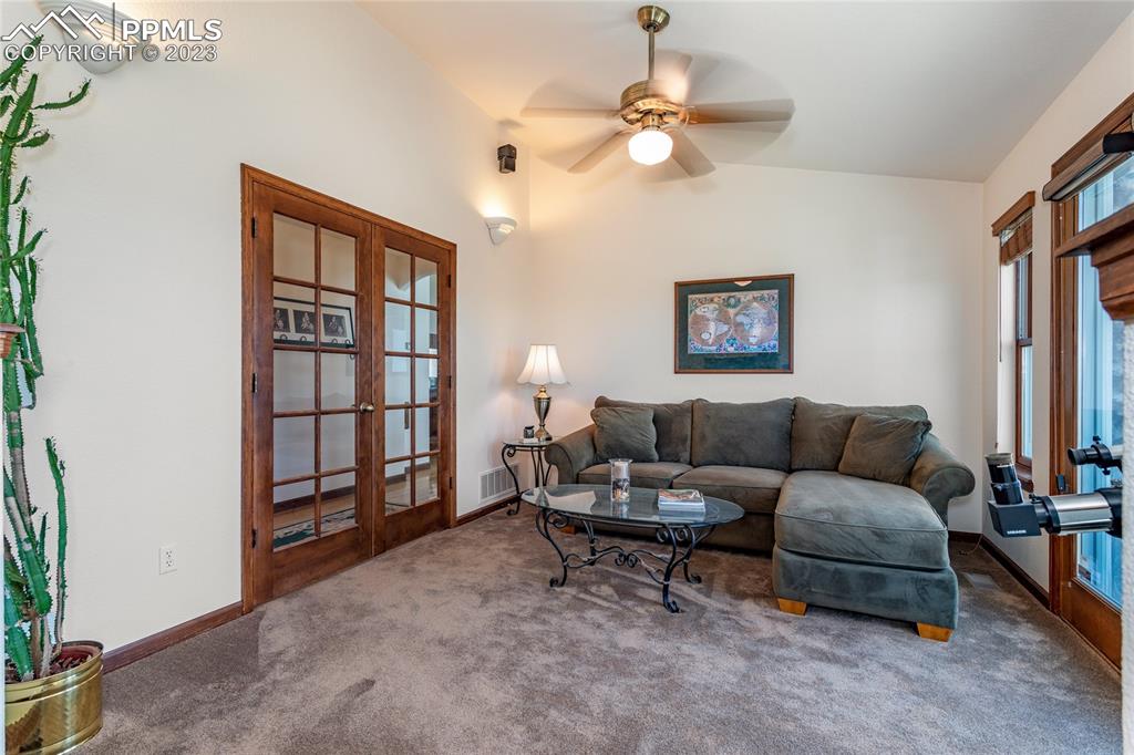 18165 Pinon Park Road Peyton, CO 80831 - Photo 22 of 44 a living room with furniture and a window