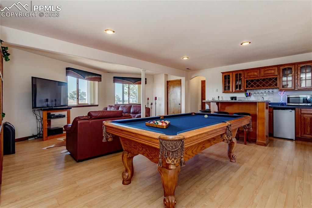 18165 Pinon Park Road Peyton, CO 80831 - Photo 28 of 44 a room with furniture pool table and window