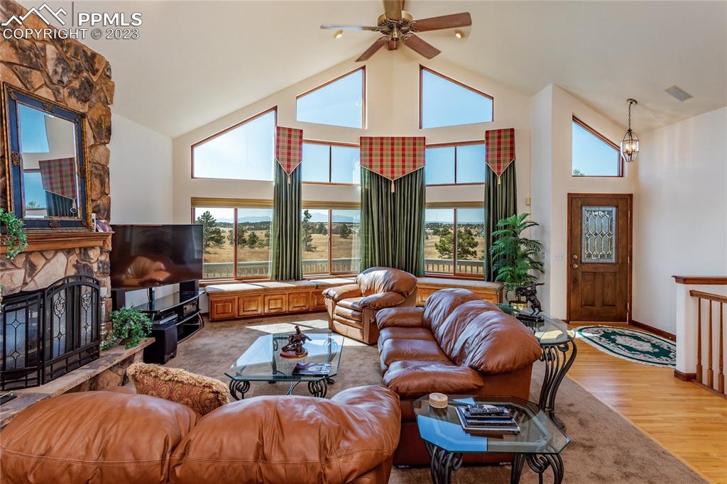 18165 Pinon Park Road Peyton, CO 80831 - Photo 3 of 44 a outdoor living space with furniture and a fireplace