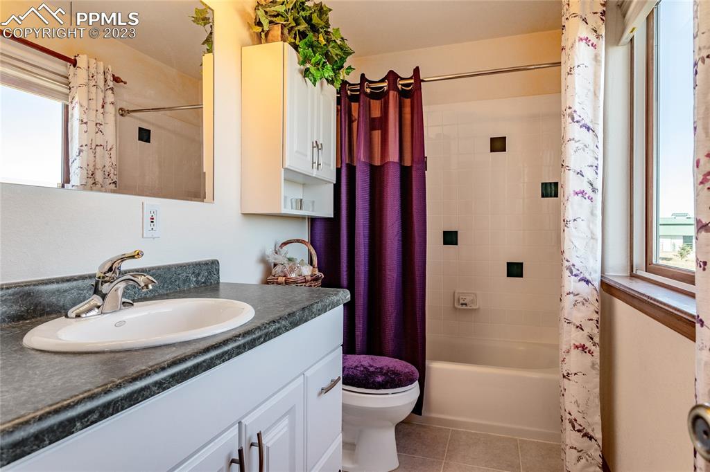 18165 Pinon Park Road Peyton, CO 80831 - Photo 34 of 44 a bathroom with a sink toilet and shower