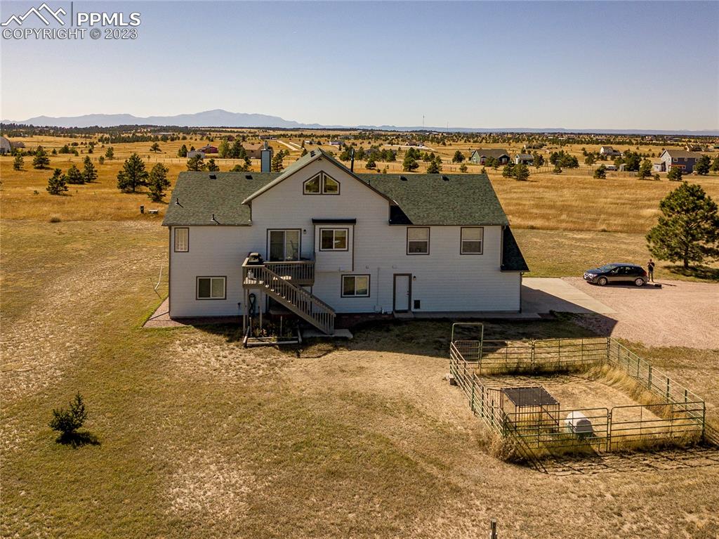 18165 Pinon Park Road Peyton, CO 80831 - Photo 35 of 44 a view of a swimming pool with an ocean view