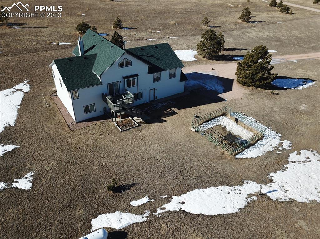 18165 Pinon Park Road Peyton, CO 80831 - Photo 38 of 44 an aerial view of a house with a yard