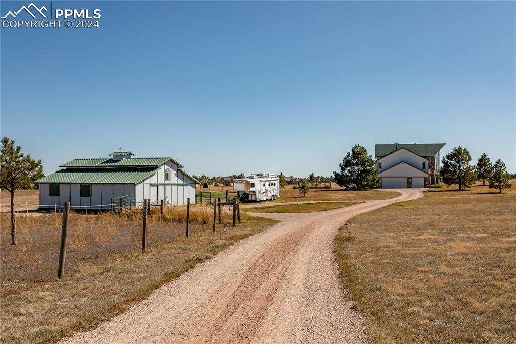18165 Pinon Park Road Peyton, CO 80831 - Photo 44 of 44 a spacious bathroom with a table and chairs