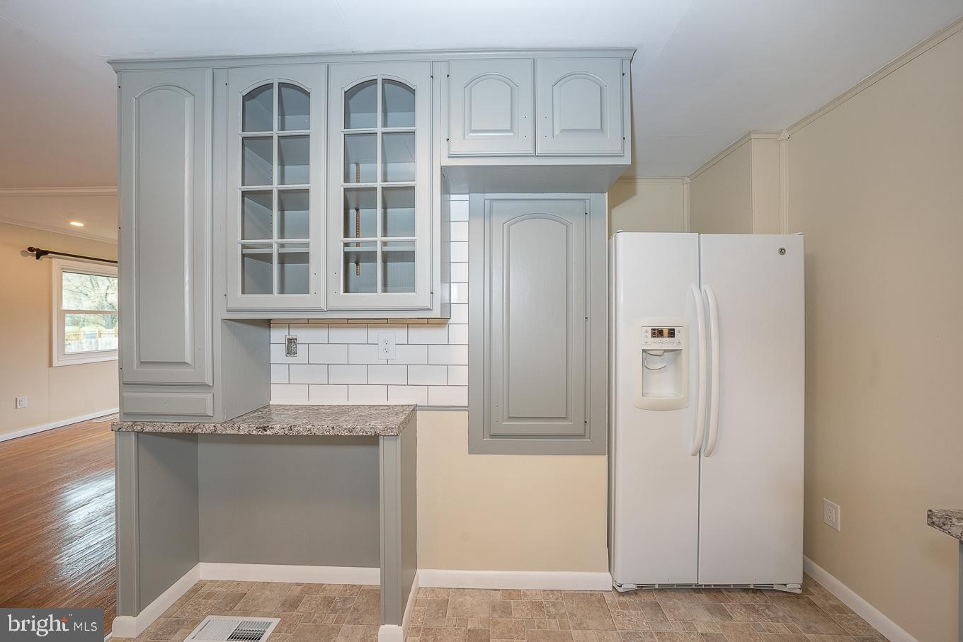 437 Meadowcroft Road Wayne, PA 19087 - Photo 5 of 19 a view of a kitchen with granite countertop cabinets and a refrigerator