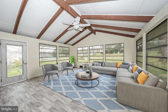 a living room with furniture and a large window