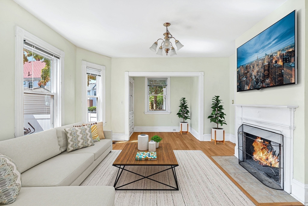 13 Weir Street Newton, MA 02466 - Photo 12 of 41 a living room with furniture and a fireplace