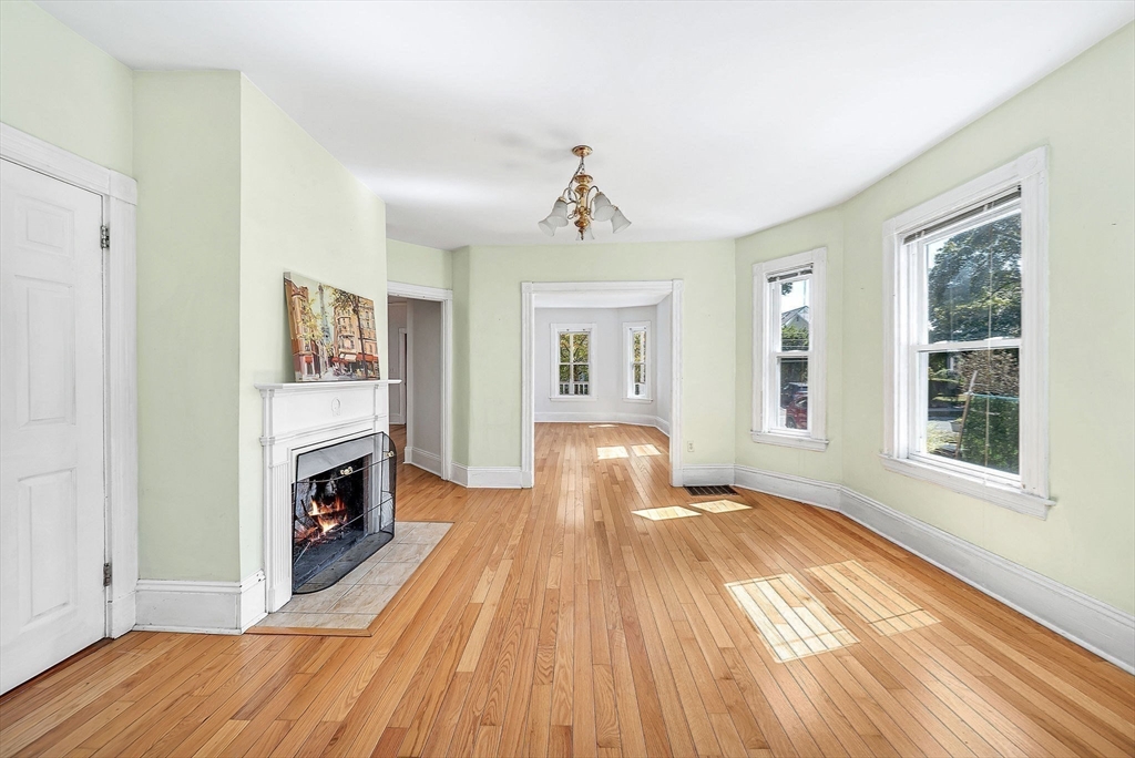 13 Weir Street Newton, MA 02466 - Photo 13 of 41 a view of livingroom with hardwood floor and a ceiling fan