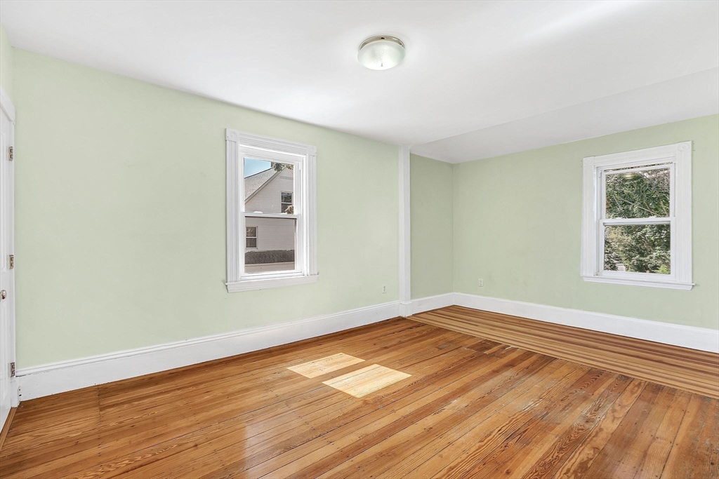 13 Weir Street Newton, MA 02466 - Photo 22 of 41 a view of empty room with wooden floor and fan
