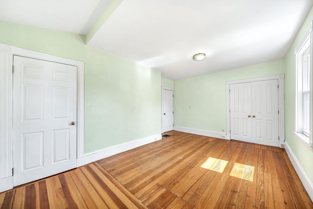 13 Weir Street Newton, MA 02466 - Photo 23 of 41 a view of empty room with wooden floor and fan