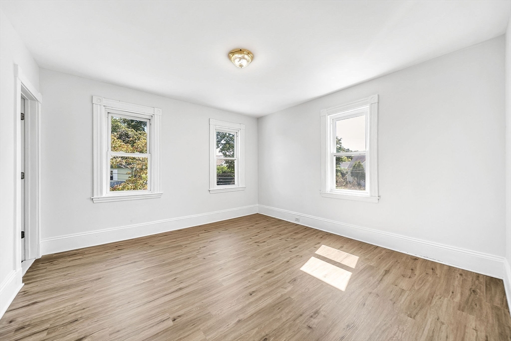 13 Weir Street Newton, MA 02466 - Photo 25 of 41 a view of empty room with wooden floor and fan