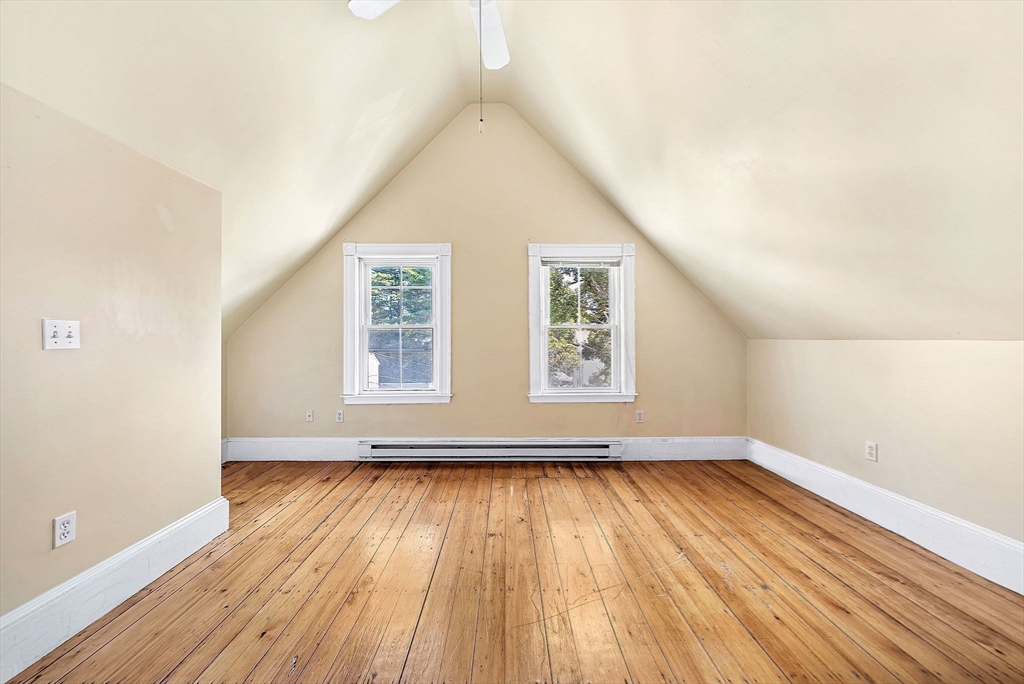 13 Weir Street Newton, MA 02466 - Photo 28 of 41 an empty room with wooden floor and windows