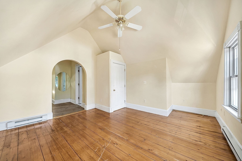 13 Weir Street Newton, MA 02466 - Photo 29 of 41 a view of empty room with wooden floor and fan