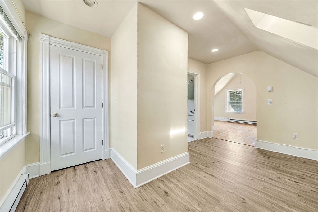 13 Weir Street Newton, MA 02466 - Photo 32 of 41 wooden floor in an empty room with a window