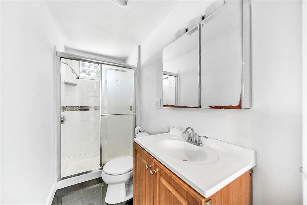 13 Weir Street Newton, MA 02466 - Photo 36 of 41 a bathroom with a sink toilet and shower