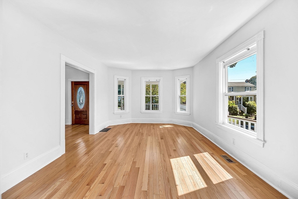 13 Weir Street Newton, MA 02466 - Photo 6 of 41 an empty room with wooden floor and windows
