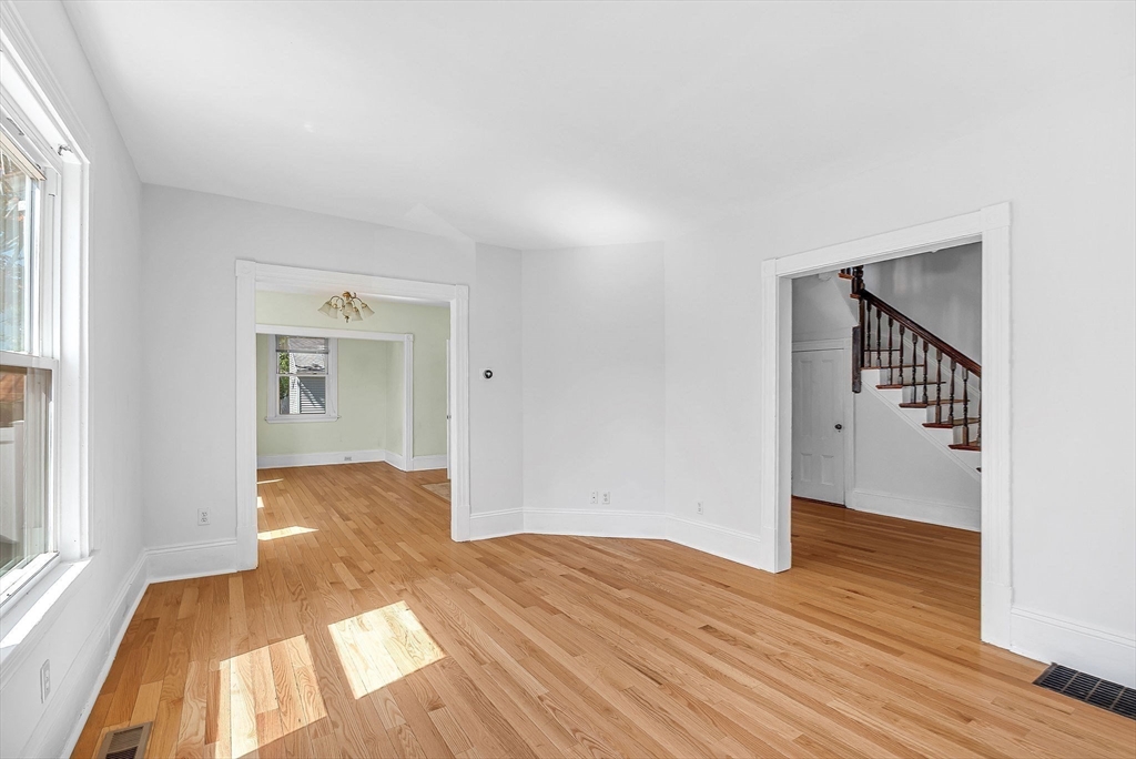 13 Weir Street Newton, MA 02466 - Photo 8 of 41 a view of a room with wooden floor and a window