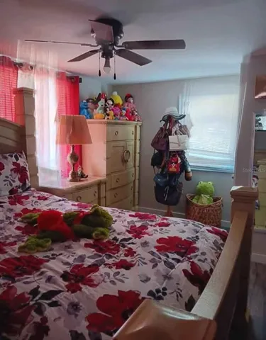 a bedroom with a bed and a view of bedroom