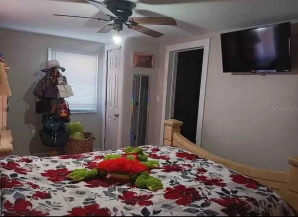 a view of a livingroom with furniture and flat screen tv