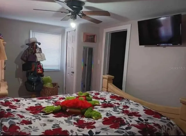 a view of a livingroom with furniture and flat screen tv