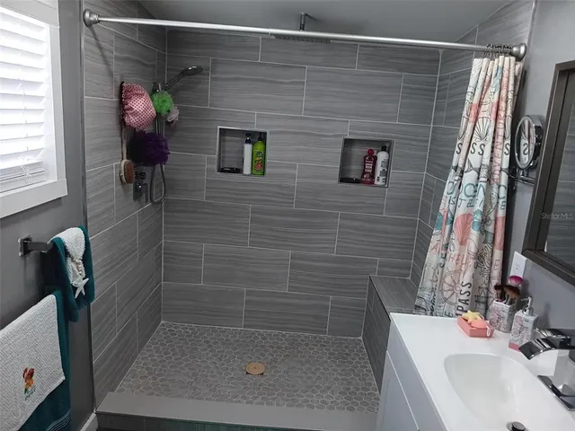 a kitchen with a cabinets and white appliances