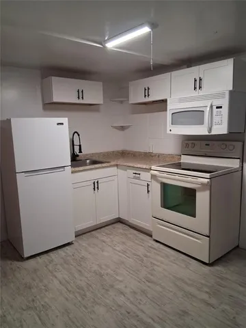 a bathroom with a shower and a door