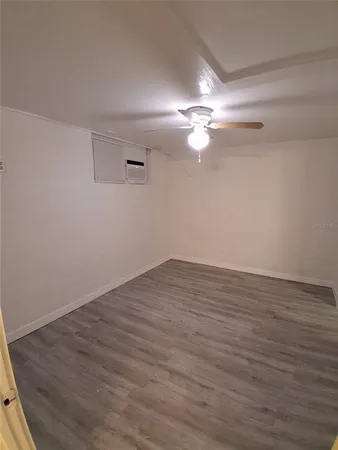 a bathroom with a glass shower door and a sink