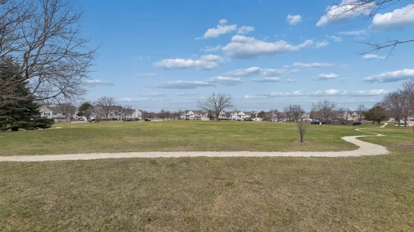 a view of a golf course with the lake