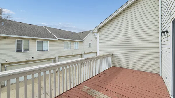 a view of a balcony with wooden floor