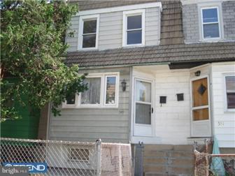549 Millbank Road Upper Darby, PA 19082 - Photo 1 of 12 a view of a brick house with a large windows